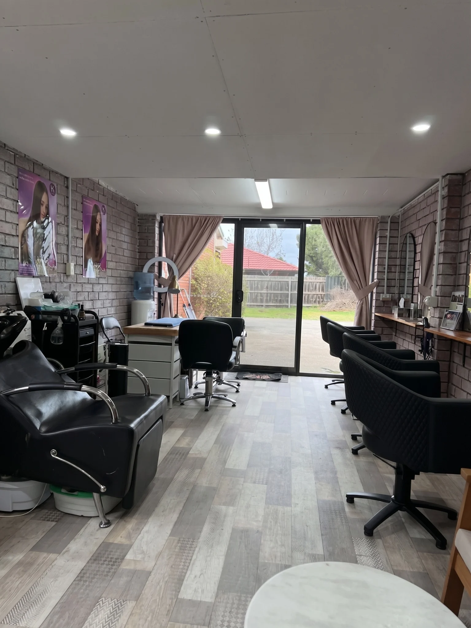 Inside Naida's Hair Salon with styling chairs